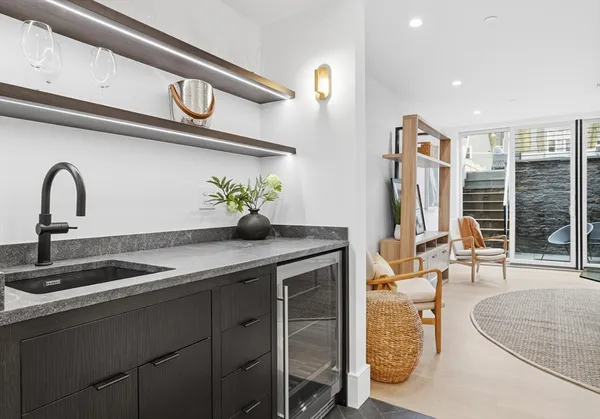 a kitchen with a sink and a stove top oven