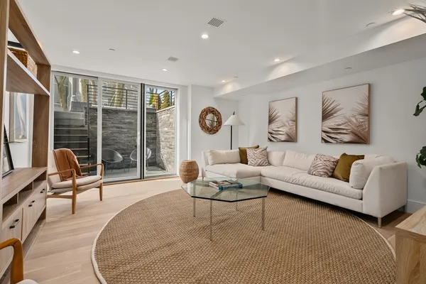 a living room with furniture and a large window
