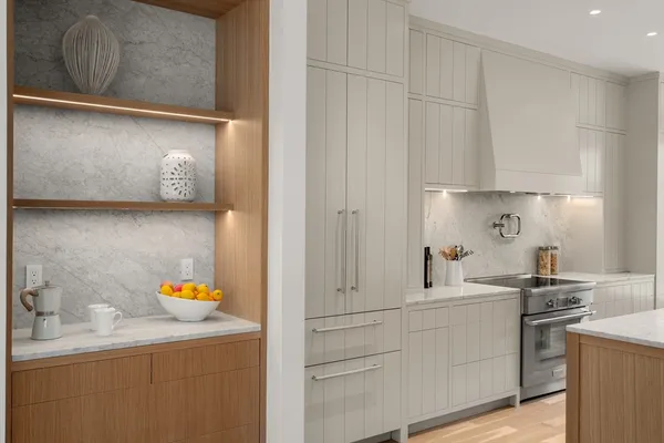 a kitchen with stainless steel appliances white cabinets and a sink