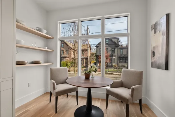 a dining room with furniture and window