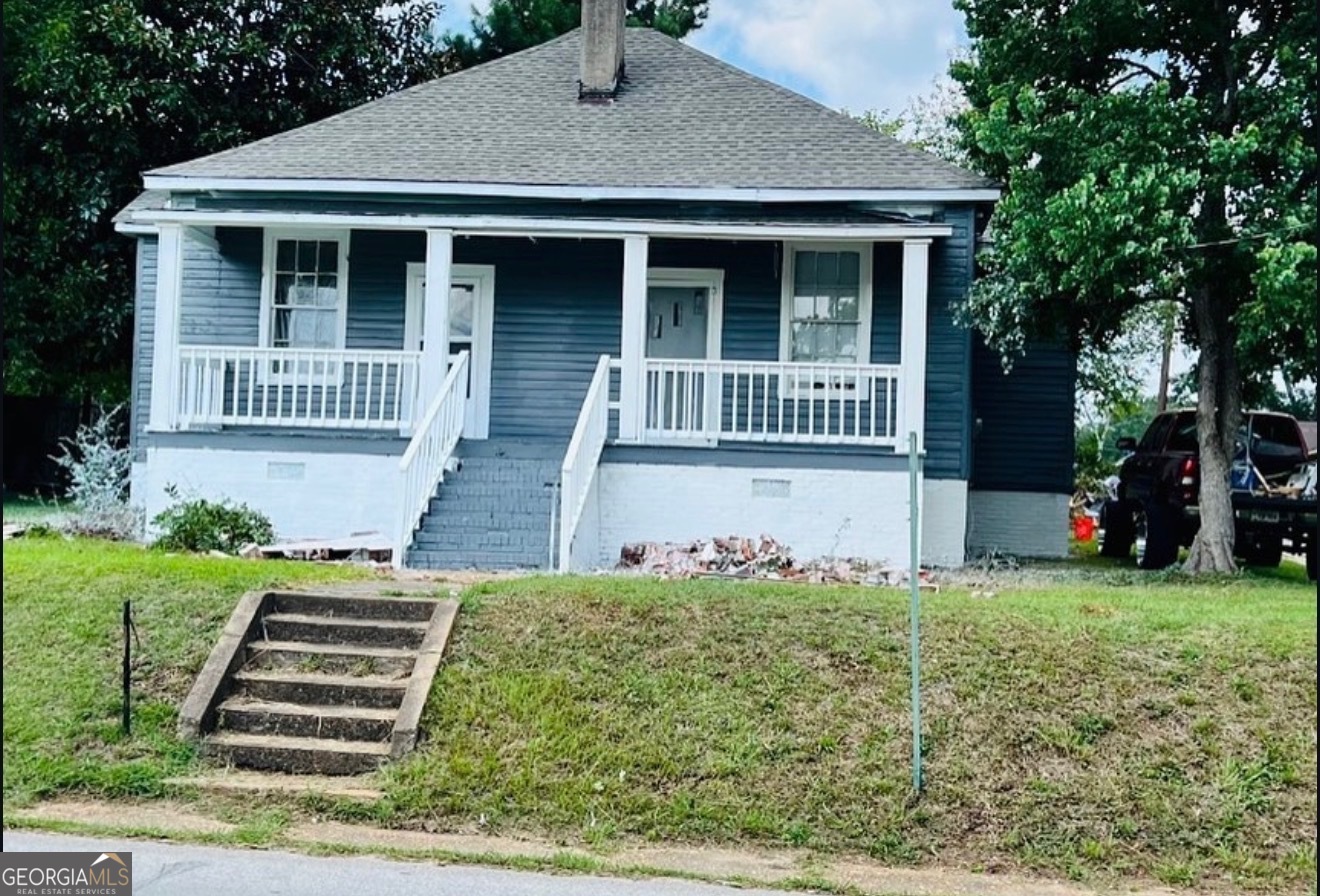 902 1st Street Lanett, AL 36863 - Photo 1 of 6 front view of a house with a yard