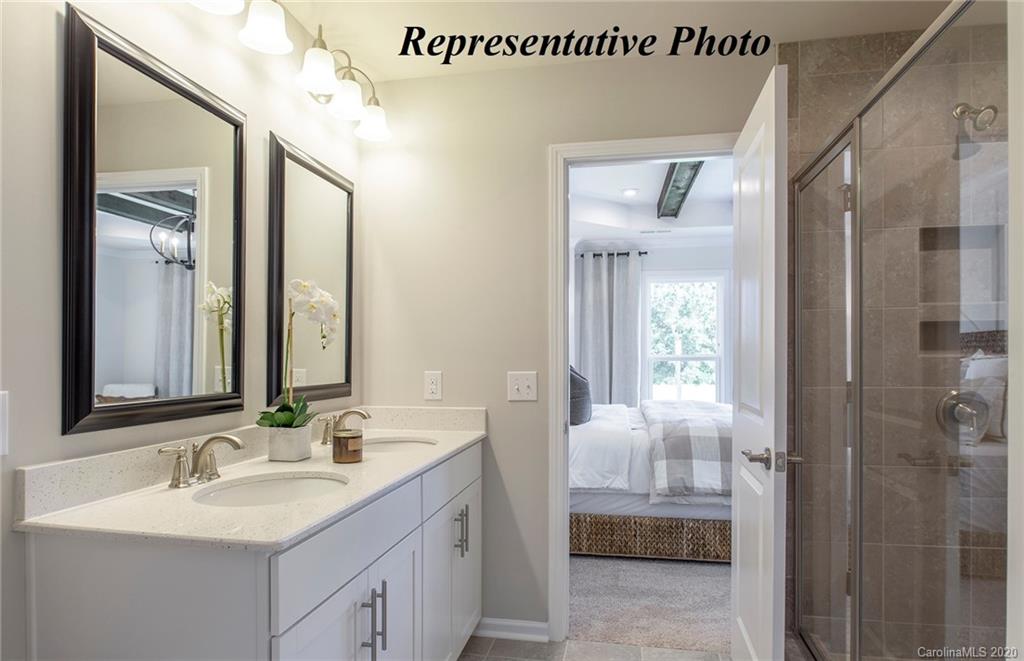 747 Elders Story Road, Unit 355 Fort Mill, SC 29708 - Photo 14 of 19 a bathroom with a sink a toilet and shower