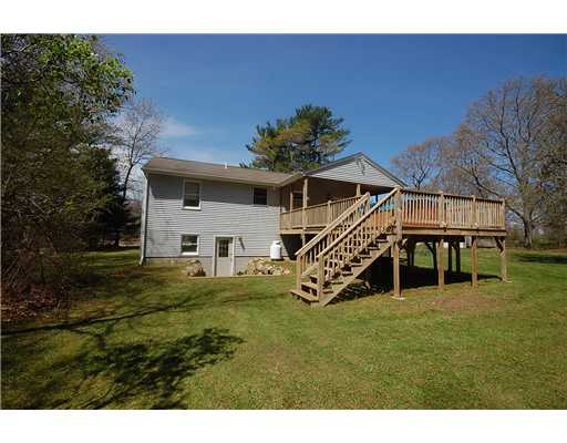 68 Tomaquag Road Hopkinton, RI 02808 - Photo 3 of 12 Exterior Back. Large rear deck half of which is covered.
