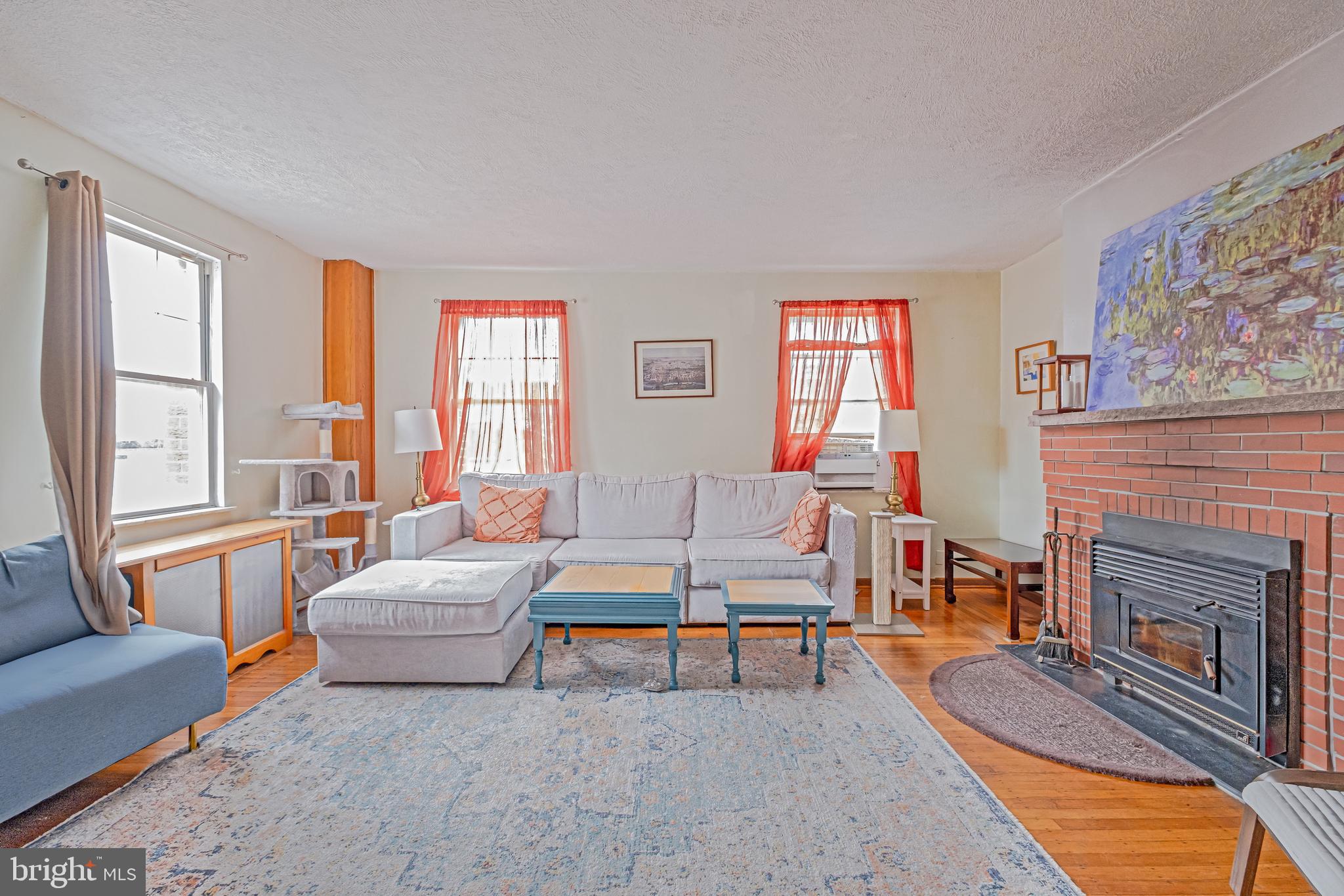 1701 Pine Street Philadelphia, PA 19103 - Photo 11 of 16 a living room with furniture and a fireplace