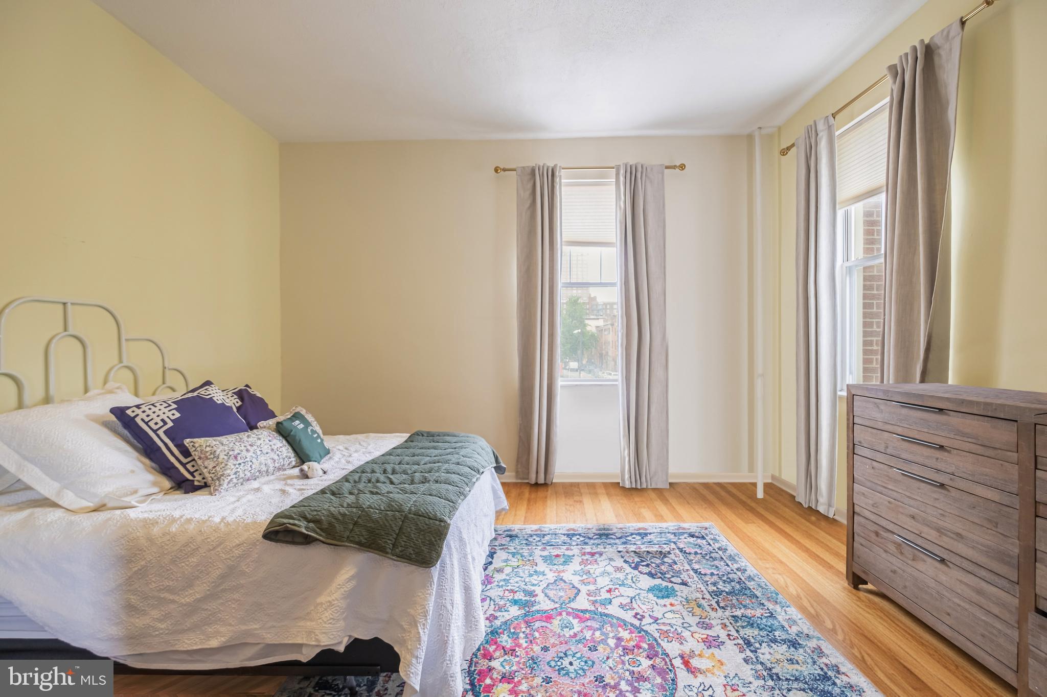 1701 Pine Street Philadelphia, PA 19103 - Photo 6 of 16 a bedroom with a bed and a window
