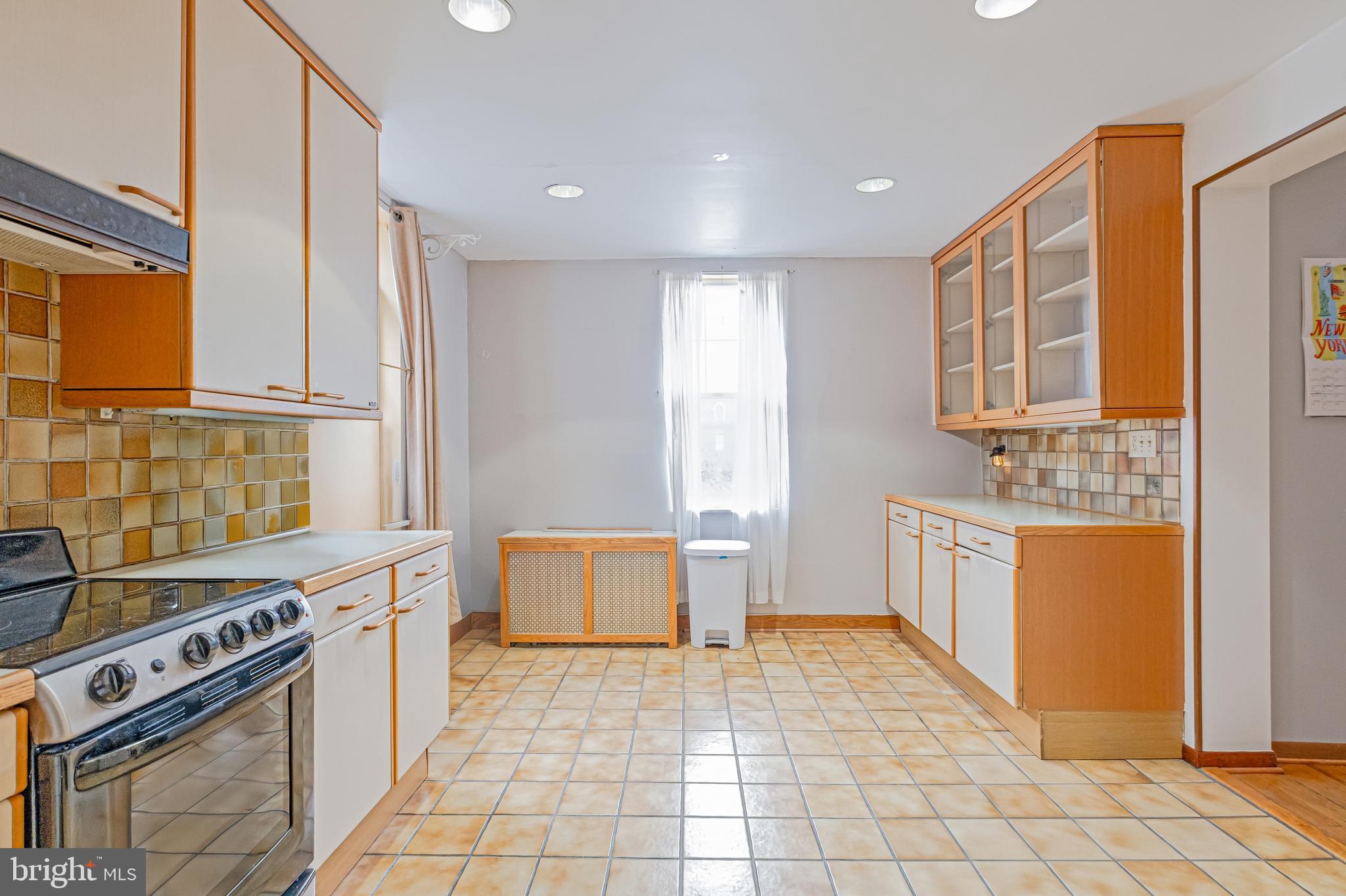 1701 Pine Street Philadelphia, PA 19103 - Photo 9 of 16 a kitchen with stainless steel appliances granite countertop a stove a sink and a microwave