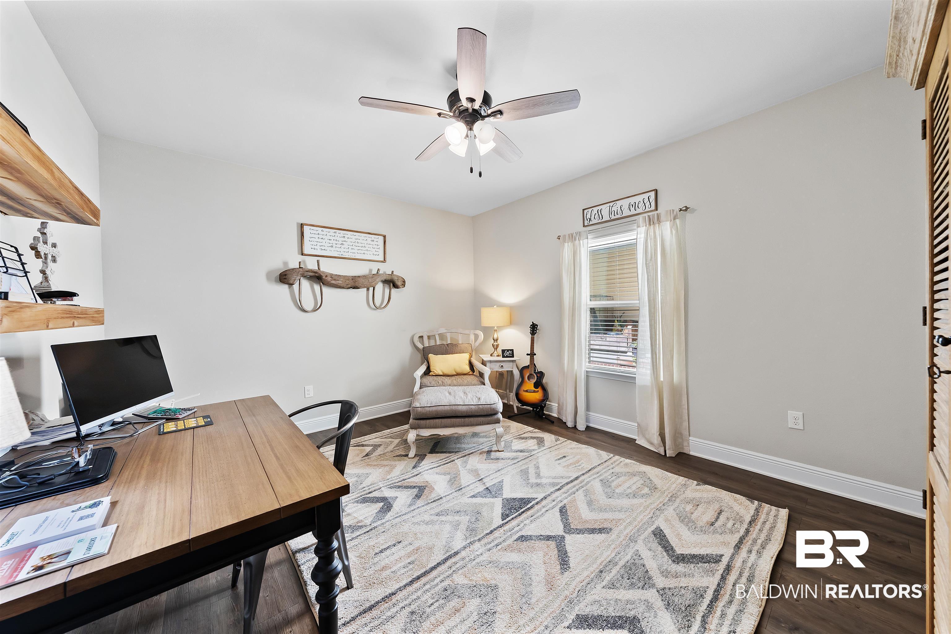 1221 Primrose Lane Foley, AL 36535 - Photo 9 of 29 Home office with dark wood finished floors, baseboards, and ceiling fan