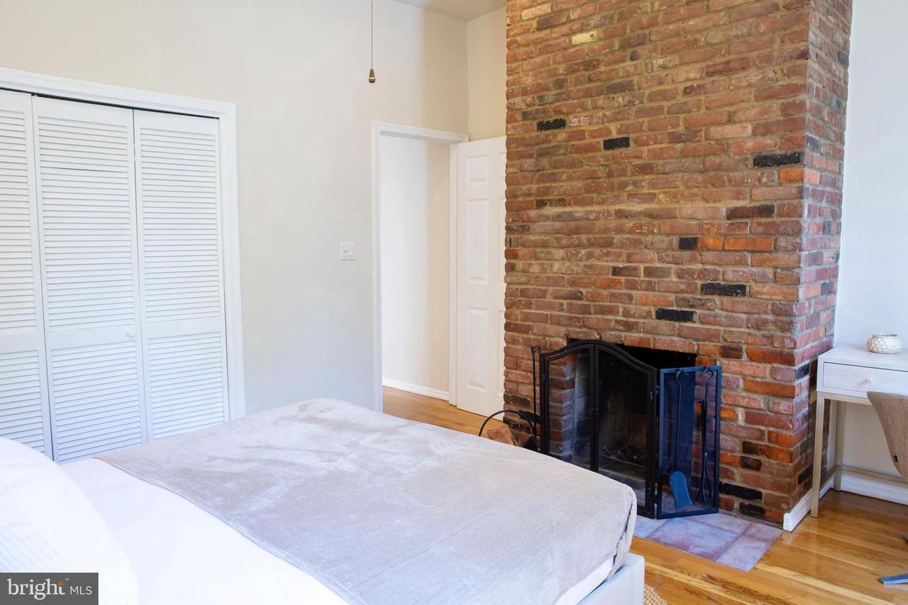 726 6th Street Northeast, Unit 1 Washington, DC 20002 - Photo 18 of 27 Front bedroom with fireplace and large closet.