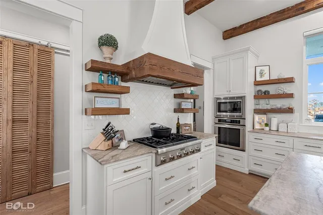 a spacious bedroom with a large bed and a window