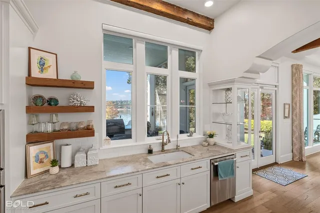 a bedroom with a bed and a flat tv screen in it