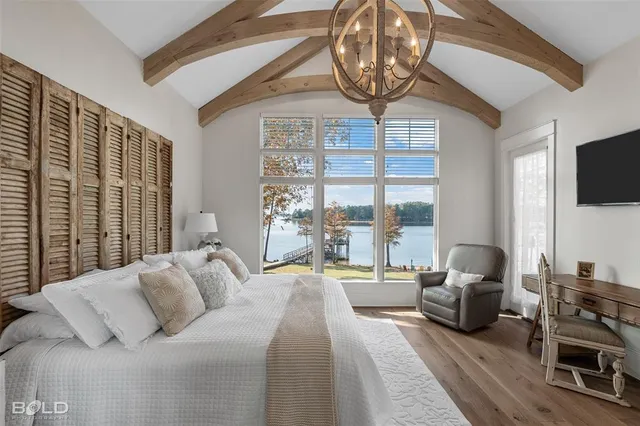 a view of a patio with table and chairs and potted plants