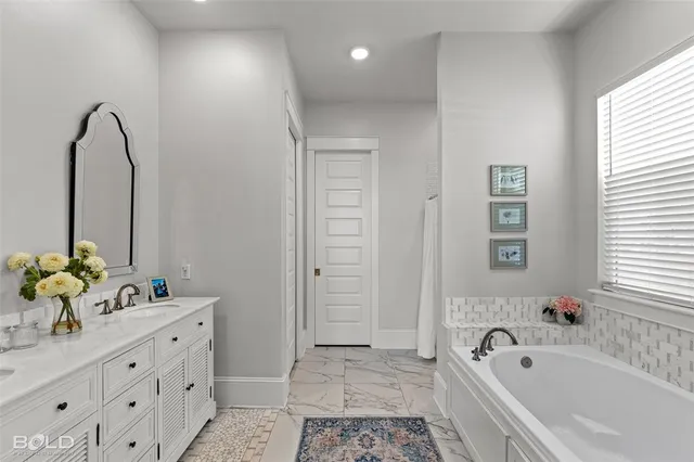 a view of a lake with a yard and large trees