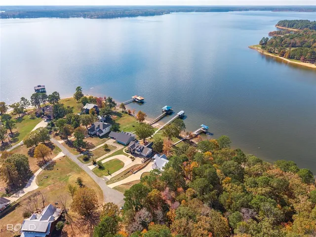 a living room with furniture a large window and a flat screen tv