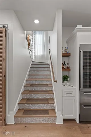 an aerial view of a house with a lake view