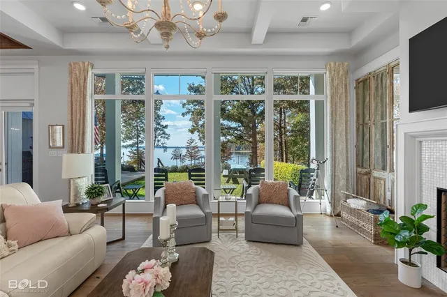 a view of a bedroom with furniture and windows