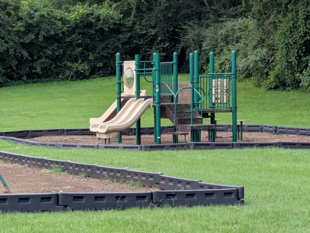 a view of a children in front of a house