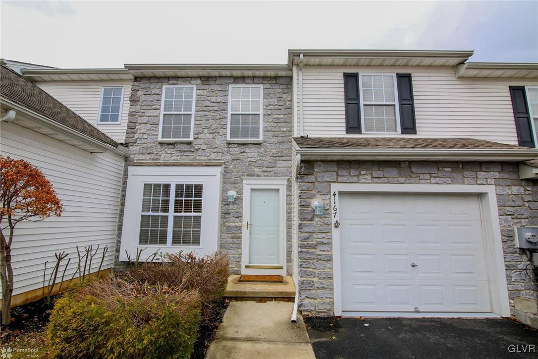 4167 Ross Road Bethlehem, PA 18020 - Photo 3 of 27 a view of a brick house with many windows