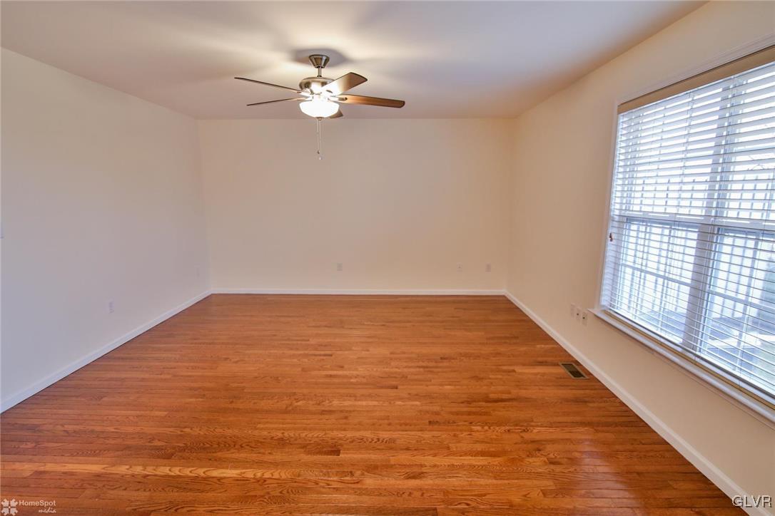 4167 Ross Road Bethlehem, PA 18020 - Photo 8 of 27 wooden floor in an empty room with a window