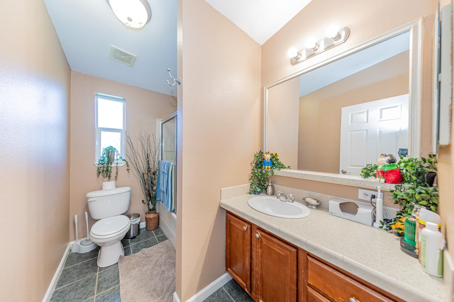 3335 Wildcat Road Mariposa, CA 95338 - Photo 17 of 48 a bathroom with a sink vanity mirror and toilet