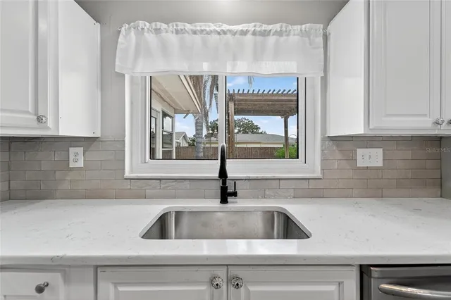 a bathroom with a sink a toilet and bathtub