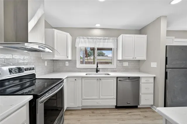 a kitchen with a sink and a cabinet
