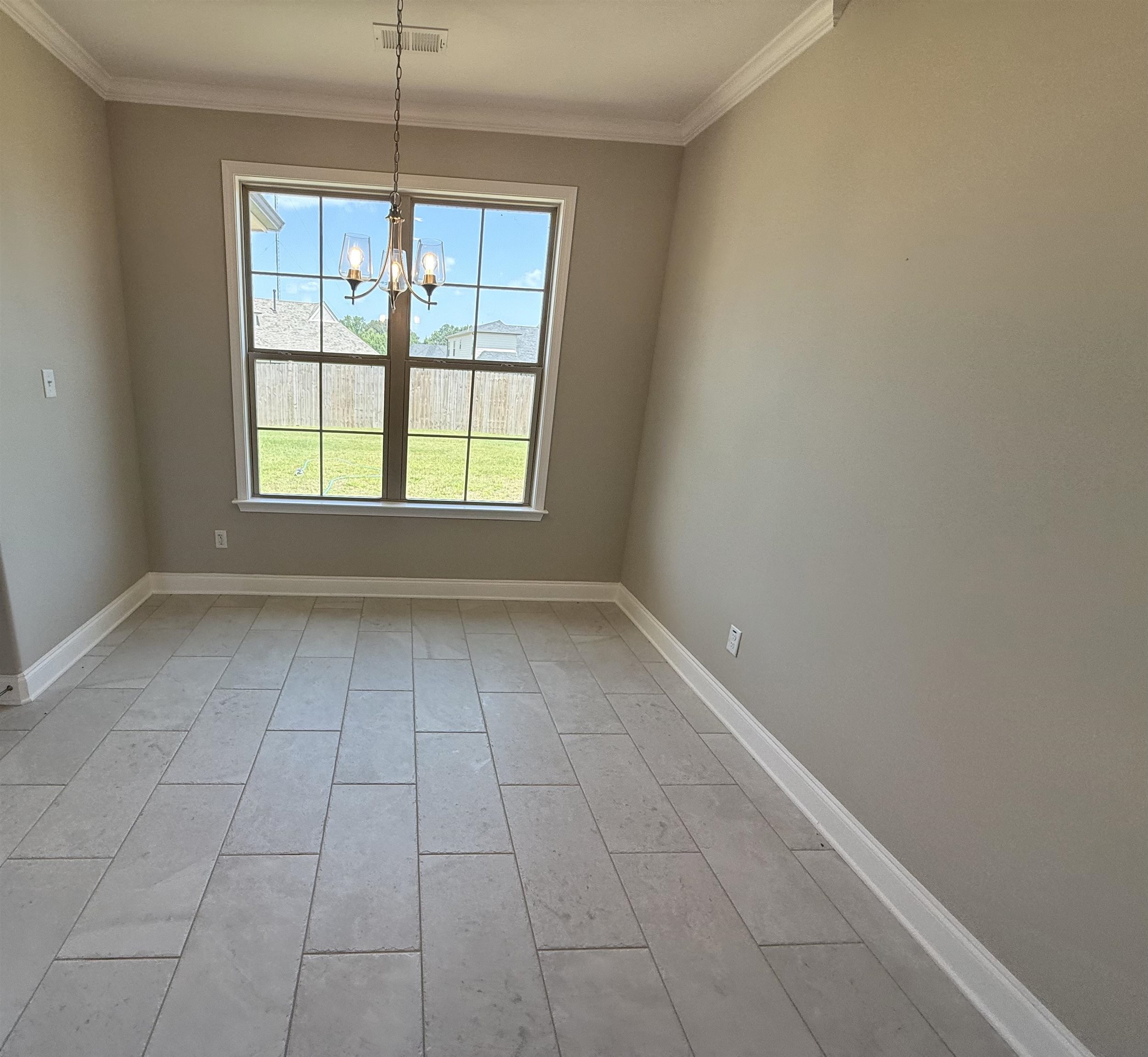 115 Misty Rdg Loop Oakland, TN 38060 - Photo 9 of 29 Breakfast area featuring a chandelier and crown molding