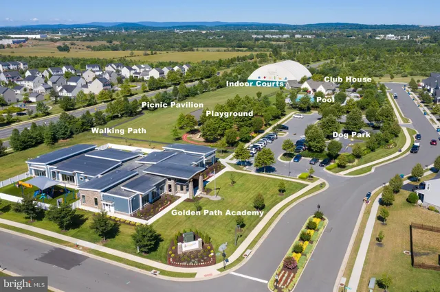 a sign board with tall buildings