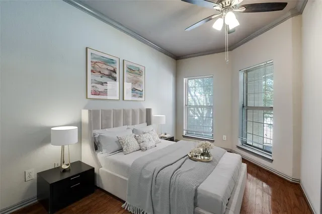 a bedroom with bed and a night stand