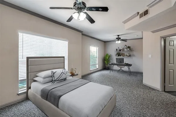 a bedroom with a large bed and a chandelier