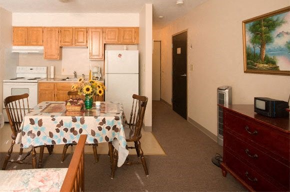 144 Cabot Street Chicopee, MA 01013 - Photo 11 of 15 a view of a dining room with furniture and a window