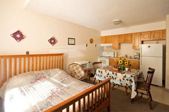 144 Cabot Street Chicopee, MA 01013 - Photo 12 of 15 a bed room with a bed and a table