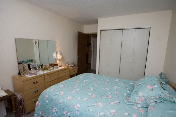 144 Cabot Street Chicopee, MA 01013 - Photo 14 of 15 a bedroom with a bed and a mirror