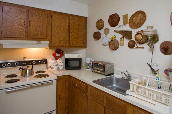 144 Cabot Street Chicopee, MA 01013 - Photo 15 of 15 a kitchen with cabinets and appliances