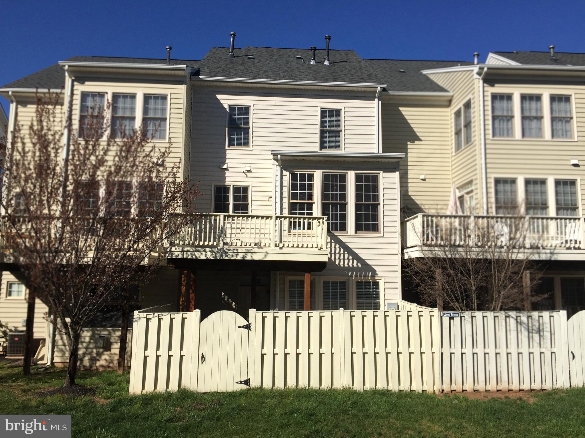 6828 Witton Circle Gainesville, VA 20155 - Photo 2 of 19 Rear View with Deck and Fence