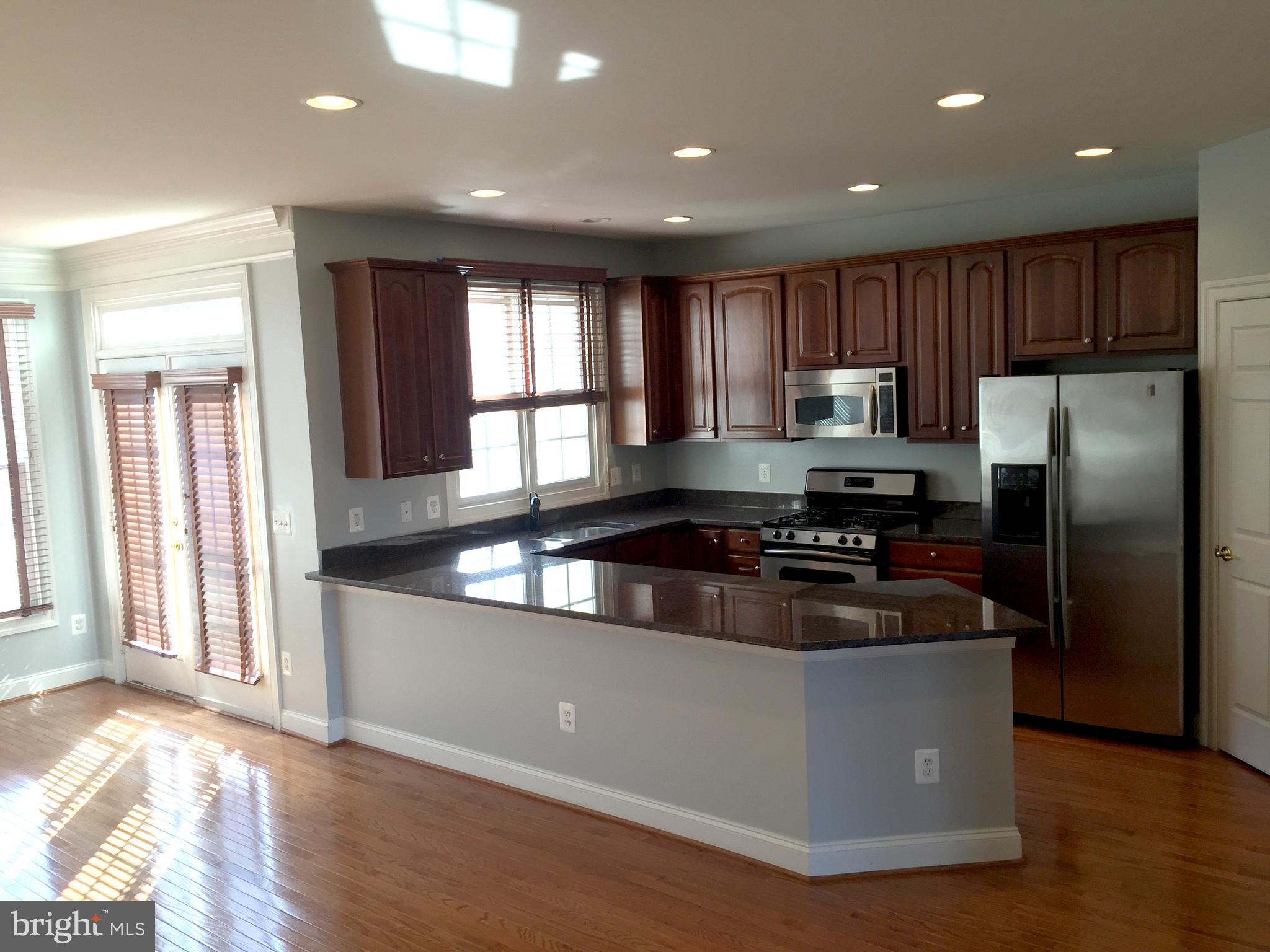 6828 Witton Circle Gainesville, VA 20155 - Photo 3 of 19 Gorgeous Kitchen with Granite and Hardwoods