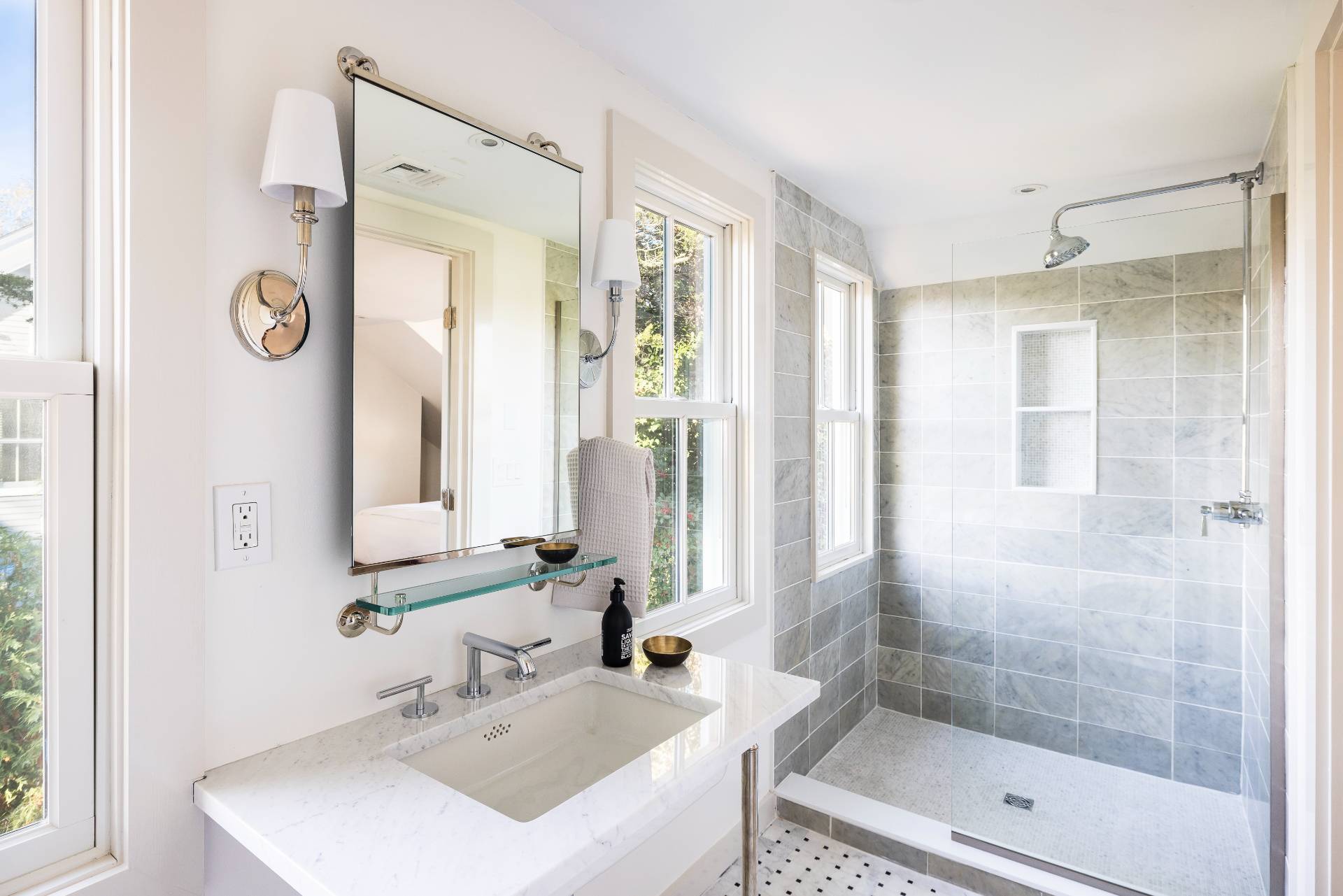 206 Division Street Sag Harbor, NY 11963 - Photo 14 of 24 a bathroom with a bathtub shower sink and mirror