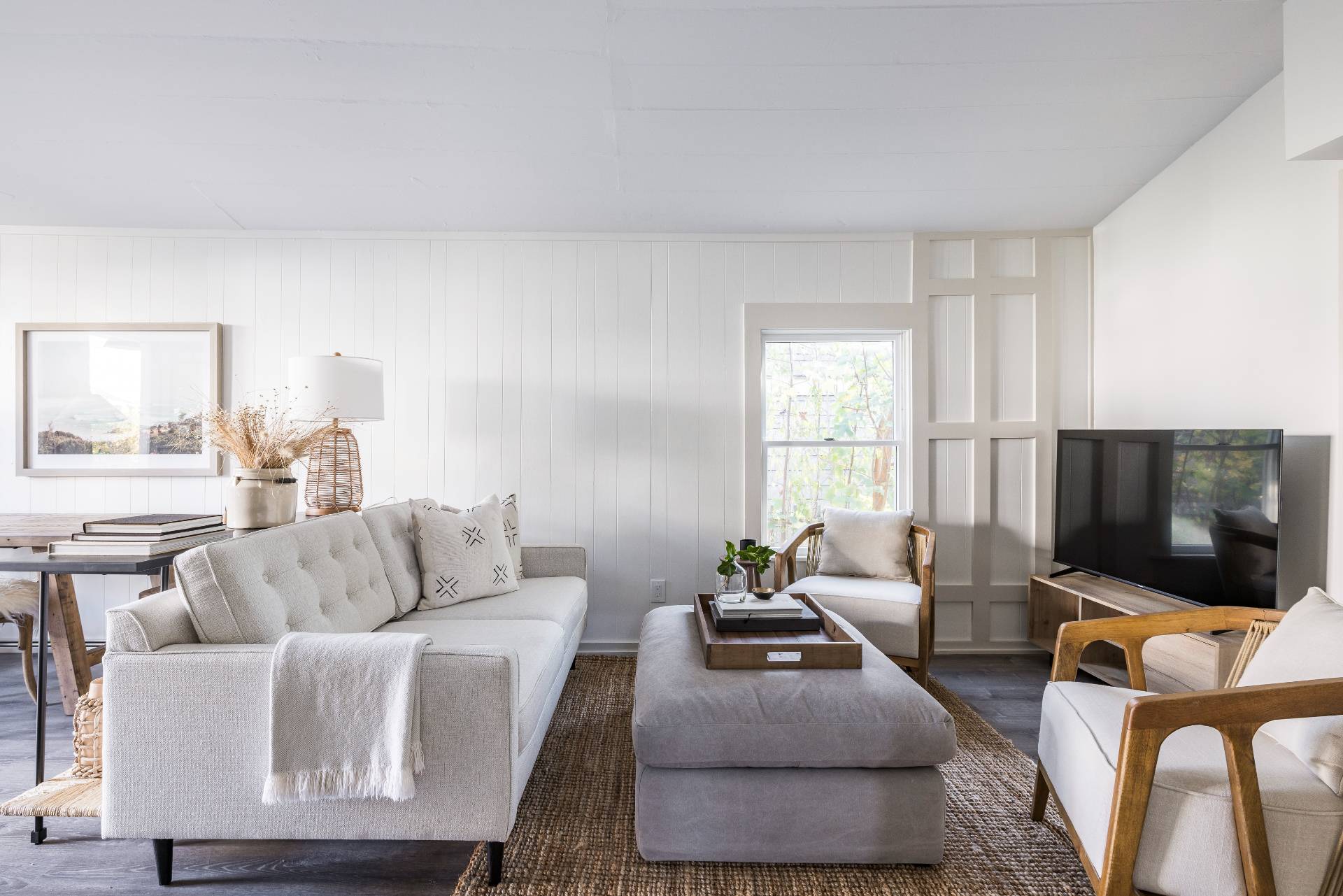 206 Division Street Sag Harbor, NY 11963 - Photo 15 of 24 a living room with furniture and a flat screen tv