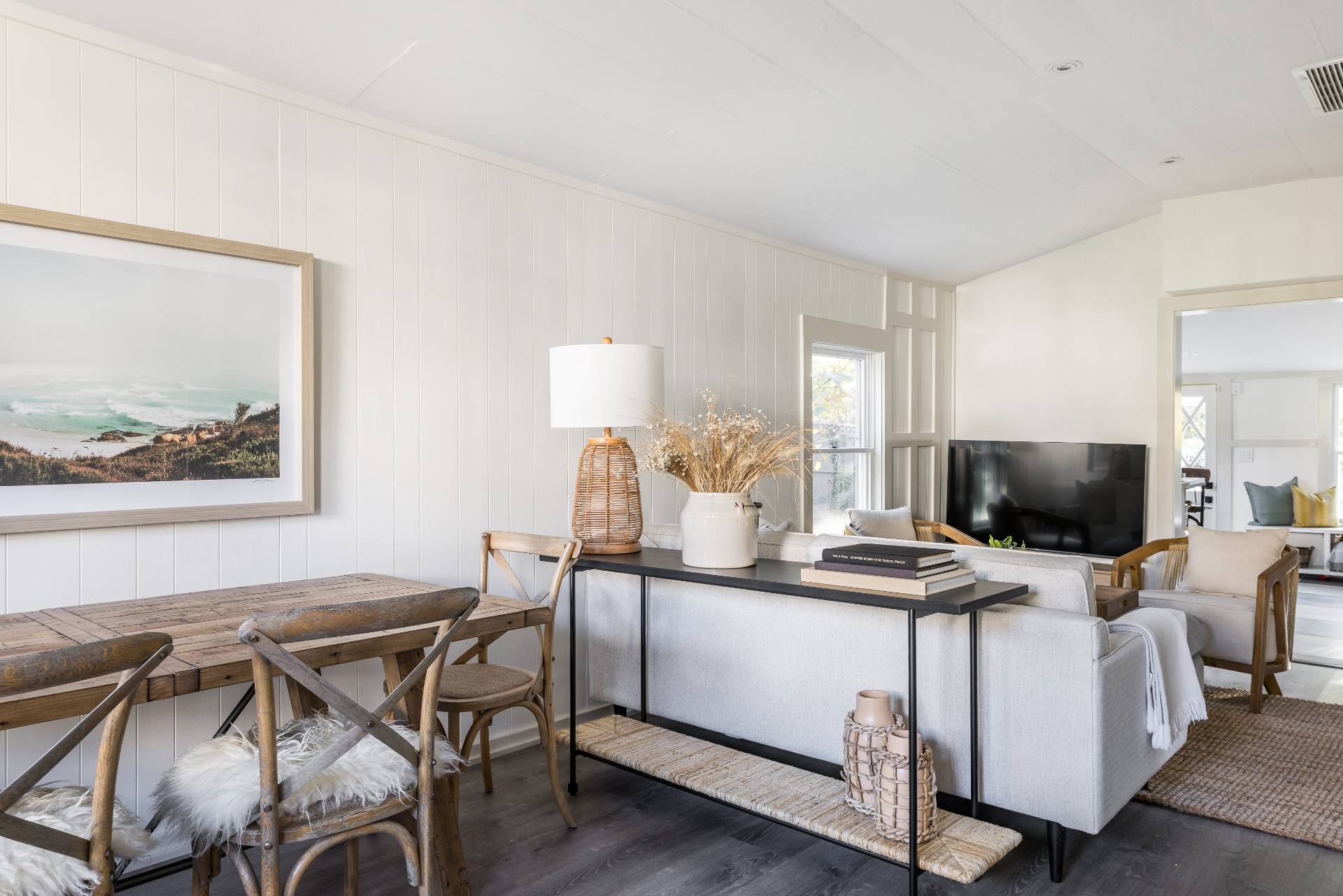 206 Division Street Sag Harbor, NY 11963 - Photo 16 of 24 a view of a dining room with furniture and a flat screen tv