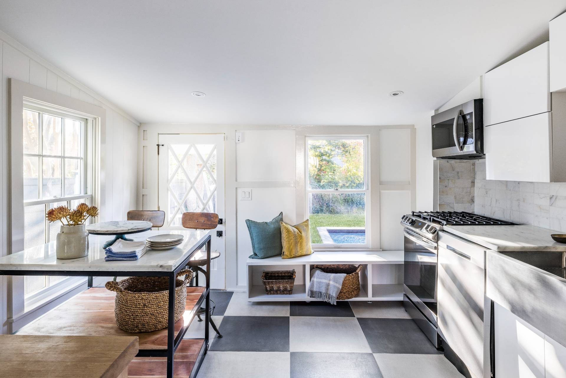 206 Division Street Sag Harbor, NY 11963 - Photo 17 of 24 a living room with furniture and large windows