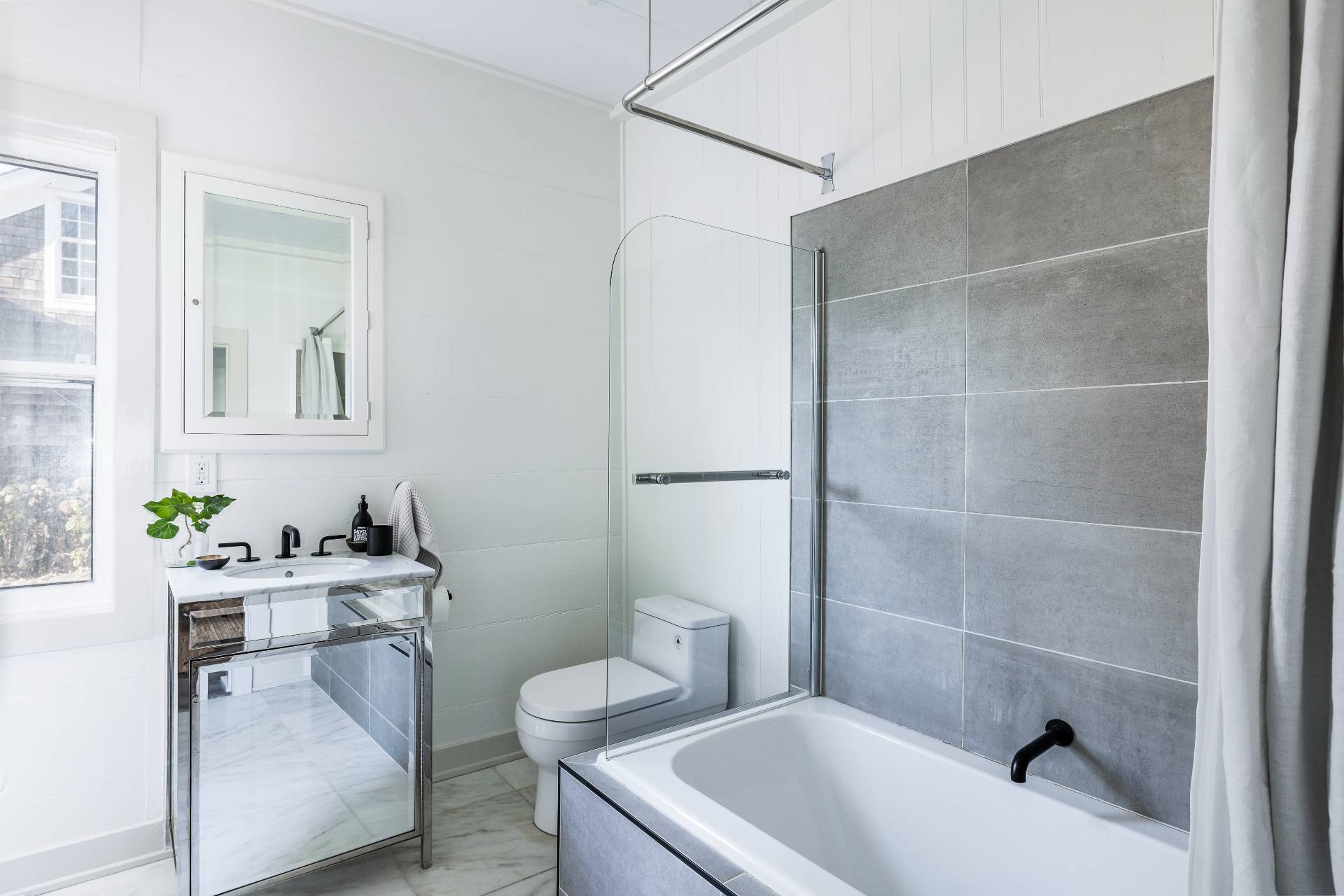 206 Division Street Sag Harbor, NY 11963 - Photo 21 of 24 a bathroom with a sink a toilet and tub