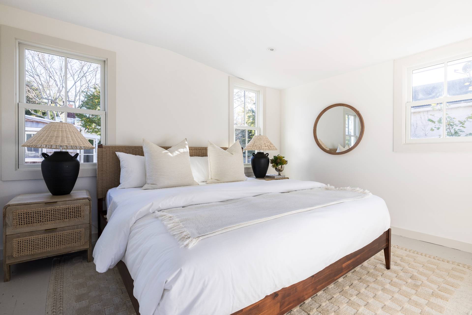 206 Division Street Sag Harbor, NY 11963 - Photo 9 of 24 a bedroom with a bed a table and chair