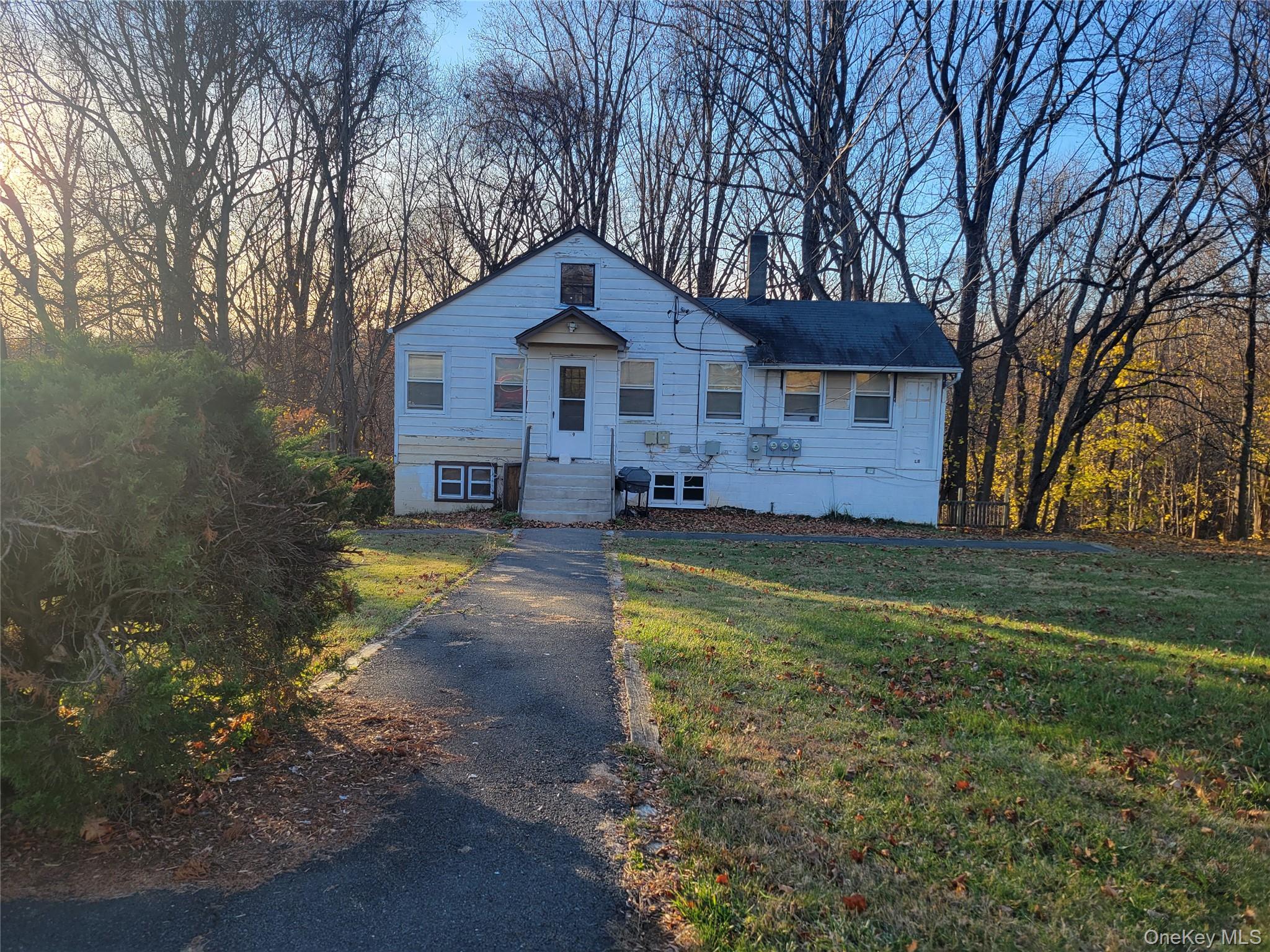 3479 Lexington Avenue, Unit L8 Mohegan Lake, NY 10547 - Photo 1 of 6 a front view of a house with a yard