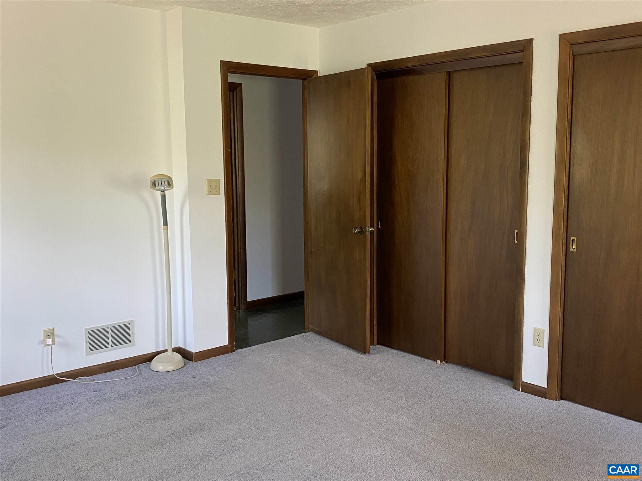 51 Oak Grove Road Palmyra, VA 22963 - Photo 23 of 52 an empty room with wooden door