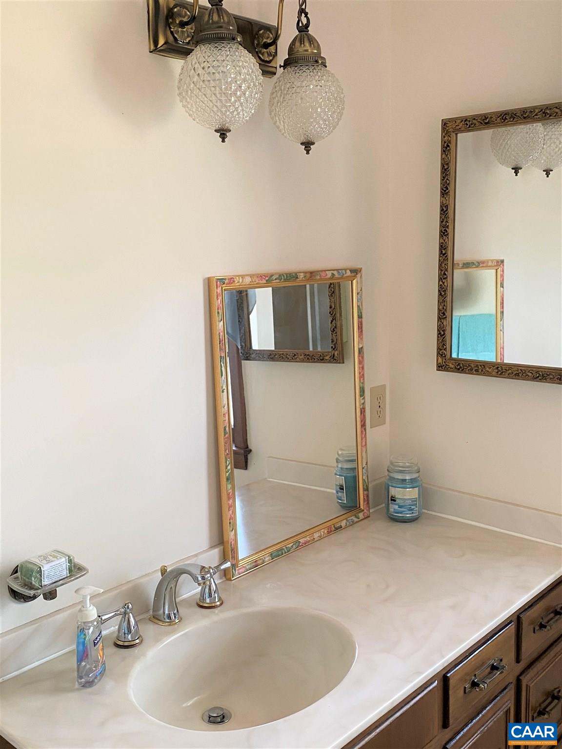 51 Oak Grove Road Palmyra, VA 22963 - Photo 28 of 52 a bathroom with a sink and a mirror