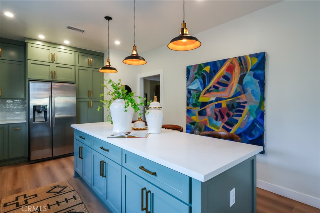 3958 Seneca Avenue Los Angeles, CA 90039 - Photo 16 of 48 a view of kitchen with stainless steel appliances granite countertop a sink a refrigerator and a stove