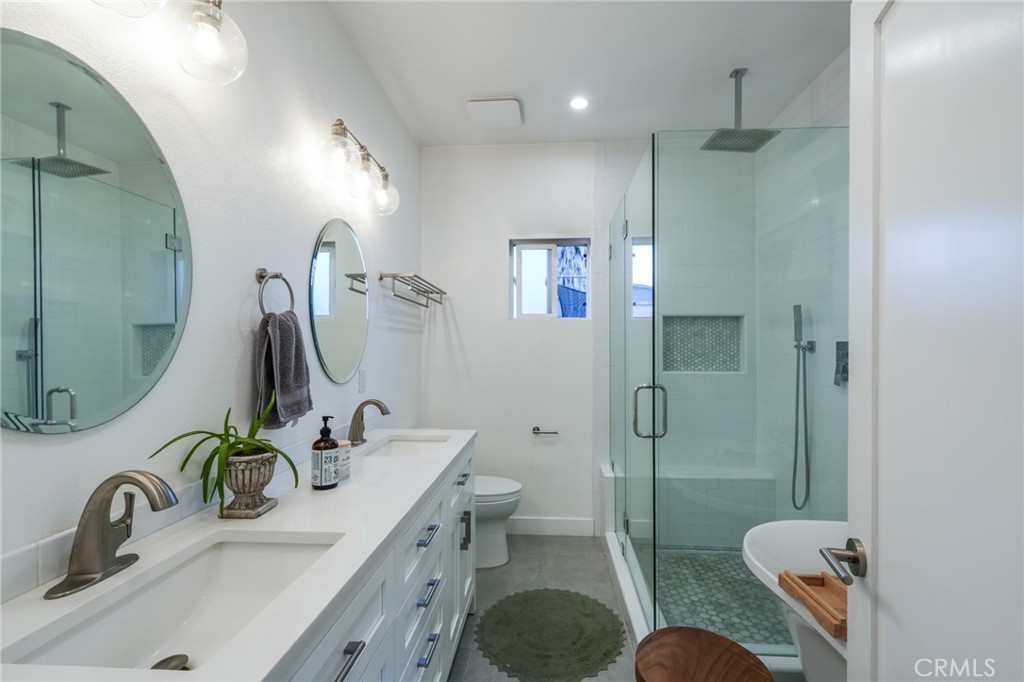 3958 Seneca Avenue Los Angeles, CA 90039 - Photo 25 of 48 a bathroom with a sink toilet and shower