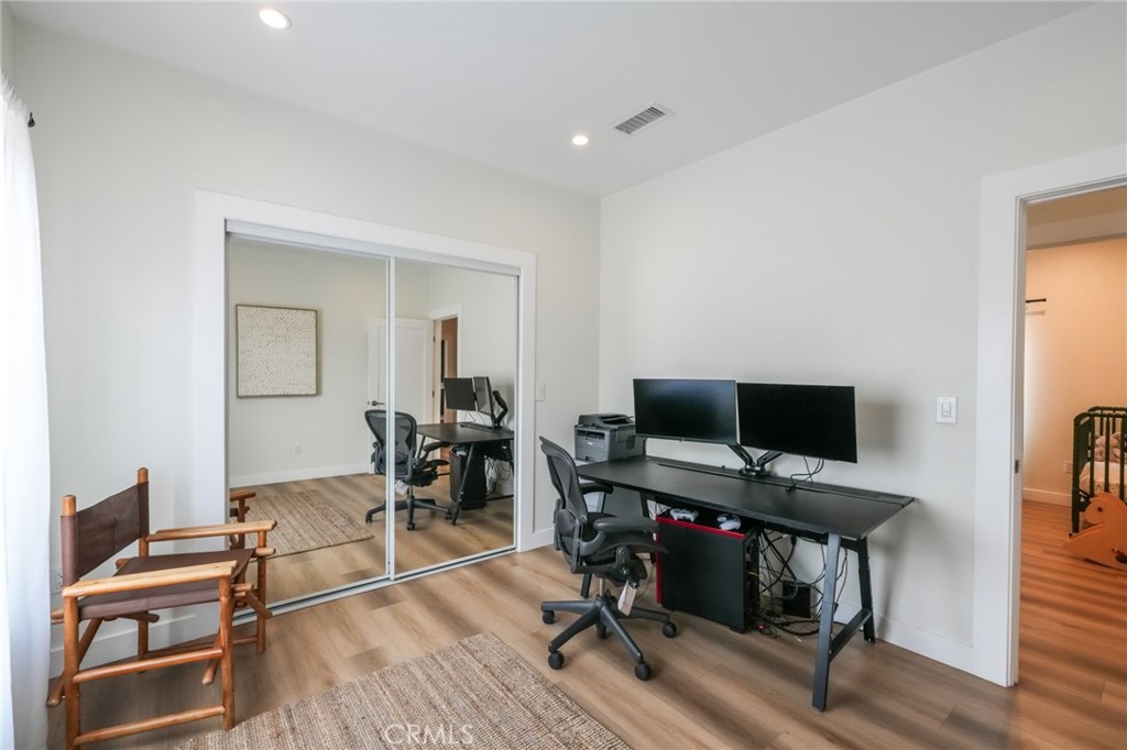 3958 Seneca Avenue Los Angeles, CA 90039 - Photo 36 of 48 a view of a workspace with furniture and wooden floor