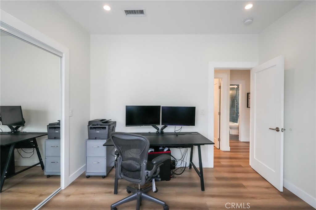 3958 Seneca Avenue Los Angeles, CA 90039 - Photo 37 of 48 a view of a workspace with furniture and wooden floor