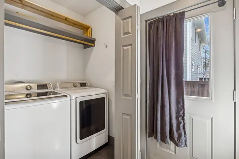 a view of a chairs and table in the balcony