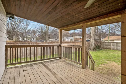 a view of a chairs and table in backyard